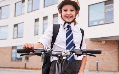 Primary school girl with scooter